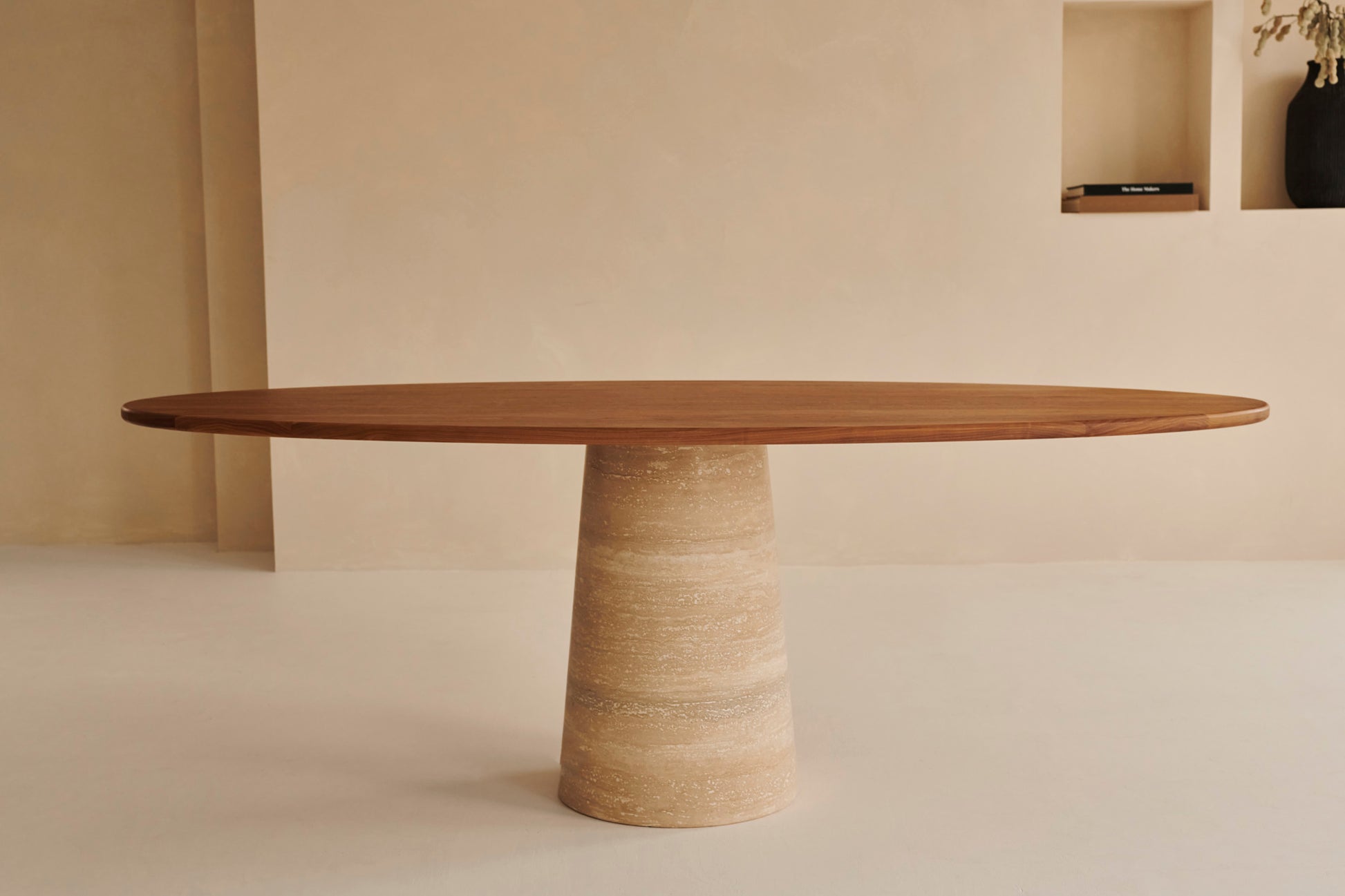 Oval walnut FLOW dining table with travertin cylinder base, modern design, 180x90 cm, crafted by My Store.