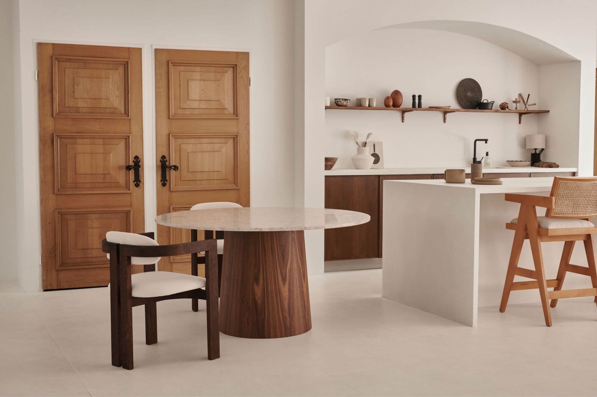 Flow round dining table by My Store with Crema Altea marble top and black cylindrical base, modern and elegant design.