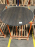 Flow round dining table in charcoal oak finish with minor edge damage, 140cm diameter, by My Store.