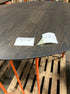 Flow round dining table in charcoal oak finish, 140cm diameter, with minor edge damage, designed for modern dining spaces.